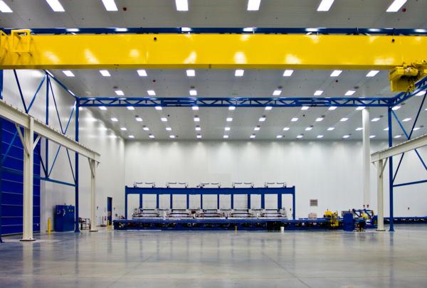 Interior of Spirit AeroSystems Composite Center. Large open room with fluorescent lighting.